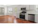 Well-equipped kitchen with stainless steel appliances, granite countertops, and plenty of cabinet space at 129 Crown Walk, Mcdonough, GA 30253