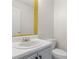 Well-maintained powder room with modern fixtures and a decorative mirror at 129 Crown Walk, Mcdonough, GA 30253