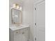 Elegant bathroom features modern vanity with gold hardware and lighting fixture at 3735 Tamiami Trl, Cumming, GA 30041