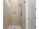 This bathroom features an open glass door shower with a built-in shower niche at 3735 Tamiami Trl, Cumming, GA 30041