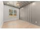 This bedroom features a grey accent wall, large windows and hardwood floors at 3735 Tamiami Trl, Cumming, GA 30041