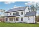Beautiful two-story home featuring white siding, dark roof, and spacious backyard at 3735 Tamiami Trl, Cumming, GA 30041