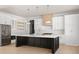 Bright kitchen features a large island with white countertops and stainless steel appliances at 3735 Tamiami Trl, Cumming, GA 30041
