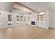 Bright living room with fireplace, built-in shelves, hardwood floors, and natural light at 3735 Tamiami Trl, Cumming, GA 30041