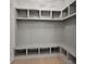 Mudroom with storage cubbies, hooks, a bench and lower storage space at 3735 Tamiami Trl, Cumming, GA 30041