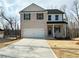 Attractive 2-story home with brick front, two-car garage, and concrete driveway at 5110 Black Bear Trl, Douglasville, GA 30135