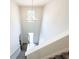 Bright foyer features a modern chandelier, high ceilings and staircase at 5342 Legacy Trl, Douglasville, GA 30135