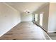 Bright living room with a ceiling fan, fireplace, and access to the outdoor deck at 5342 Legacy Trl, Douglasville, GA 30135