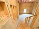 View of unfinished basement with wood framing, concrete foundation and stairs at 5342 Legacy Trl, Douglasville, GA 30135