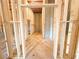 Framed opening in unfinished basement showing concrete floors and interior framing at 5547 Bent Grass Way, Douglasville, GA 30135