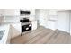 Well-lit kitchen boasting new stainless appliances and a granite countertop at 5547 Bent Grass Way, Douglasville, GA 30135