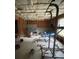 Interior view of a basement area with wooden frame, weight training equipment and insulation at 582 Georgia Cir, Loganville, GA 30052