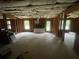 Unfinished basement featuring rough ceiling, frame, and exterior doors and windows at 582 Georgia Cir, Loganville, GA 30052