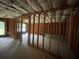 Partially finished basement with visible frame and insulation and light from egress windows at 582 Georgia Cir, Loganville, GA 30052