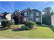 Charming two-story home with landscaped yard and brick and stone exterior, perfect for curb appeal at 582 Georgia Cir, Loganville, GA 30052