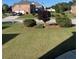 Well maintained lawn with healthy trees, shrubbery and mulch at 582 Georgia Cir, Loganville, GA 30052