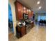 Functional kitchen with tile floors, wooden cabinets, and stainless steel appliances at 582 Georgia Cir, Loganville, GA 30052