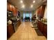Functional kitchen with tile floors, wooden cabinets, and stainless steel appliances at 582 Georgia Cir, Loganville, GA 30052