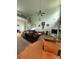 Open-concept living room with a large window, high ceilings, and access to the staircase at 582 Georgia Cir, Loganville, GA 30052