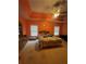 Spacious primary bedroom with a tray ceiling, ceiling fan, two windows and carpet flooring at 582 Georgia Cir, Loganville, GA 30052