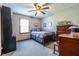 Comfortable bedroom with carpeting, natural light and wood furniture at 1102 Waverly Dr, Lawrenceville, GA 30046