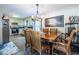 Charming dining area with a wooden table, chandelier lighting, and kitchen access at 1102 Waverly Dr, Lawrenceville, GA 30046