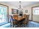 Inviting dining room with a wooden table, chandelier lighting, and access to the patio at 1102 Waverly Dr, Lawrenceville, GA 30046