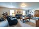 Spacious living room with cozy seating, windows, and decor at 1102 Waverly Dr, Lawrenceville, GA 30046