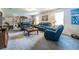 Large living room with comfortable seating and bright windows at 1102 Waverly Dr, Lawrenceville, GA 30046