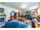 Open living room with comfortable seating, fireplace and mounted TV at 1102 Waverly Dr, Lawrenceville, GA 30046