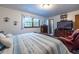 Bright main bedroom offering dark furniture, light walls, carpeting and natural light at 1102 Waverly Dr, Lawrenceville, GA 30046