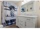 Bathroom featuring a marble vanity top with modern mirror and artistic shower curtain at 1154 Pinebrook Rd, Auburn, GA 30011