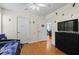 Bedroom with laminate floor, a window, and modern black dresser with TV at 1154 Pinebrook Rd, Auburn, GA 30011