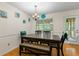 Lovely dining room with wood floors, white wainscoting, and a back door at 1154 Pinebrook Rd, Auburn, GA 30011