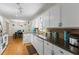 Bright kitchen with stainless steel appliances, wood floors, and granite countertops at 1154 Pinebrook Rd, Auburn, GA 30011