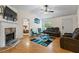 Cozy living room featuring a fireplace, wood floors, and comfortable seating arrangements at 1154 Pinebrook Rd, Auburn, GA 30011
