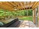 Enclosed porch overlooks the lawn with wooded views at 1154 Pinebrook Rd, Auburn, GA 30011
