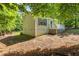 This single story home features a well-maintained exterior with a rear deck and lush landscaping at 1154 Pinebrook Rd, Auburn, GA 30011