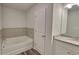 Bathroom with a tub-shower combination, white cabinets, and granite countertops at 2 Loth Wages (Lot 2) Rd, Dacula, GA 30019
