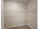 Walk-in closet providing ample storage space and wire shelving at 28 Loth Wages (Lot 28) Rd, Dacula, GA 30019