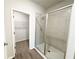 Modern bathroom with a glass-enclosed shower and a spacious walk-in closet at 5295 Greenway Dr, Villa Rica, GA 30180