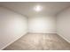 A well-lit bedroom with neutral carpet flooring and spacious layout at 5295 Greenway Dr, Villa Rica, GA 30180