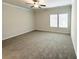 Spacious bedroom with soft carpet, neutral walls, and natural light at 5295 Greenway Dr, Villa Rica, GA 30180