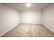 A well-lit bedroom with neutral carpet flooring and spacious layout at 5295 Greenway Dr, Villa Rica, GA 30180