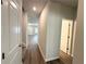 Hallway view showing interior doors and hardwood floors, enhancing the home's charm at 5295 Greenway Dr, Villa Rica, GA 30180