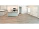 Beautiful kitchen with an island, light wood flooring, and an eat-in dining area at 5295 Greenway Dr, Villa Rica, GA 30180