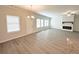 Spacious living room with lots of natural light, neutral paint, fireplace, and large island with sink at 5295 Greenway Dr, Villa Rica, GA 30180