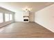 Spacious living room with lots of natural light, neutral paint, and fireplace at 5295 Greenway Dr, Villa Rica, GA 30180