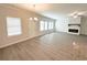 Spacious living room with lots of natural light, neutral paint, fireplace, and large island with sink at 5295 Greenway Dr, Villa Rica, GA 30180