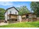 Spacious backyard with a covered patio and lush green lawn, great for entertaining at 1228 Ladd Sw St, Atlanta, GA 30310